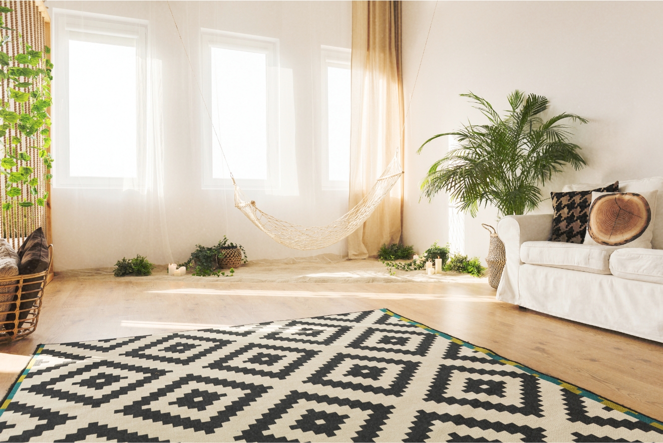 Sustainable home interior featuring eco-friendly home decor: natural light, indoor plants, geometric rug made from sustainable materials, and minimalist furniture, creating a harmonious, green living space