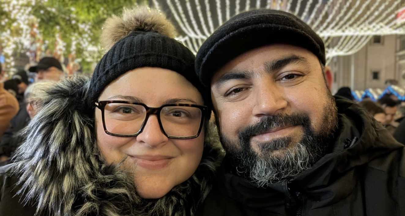 Man and woman in cold weather attire. New Years Eve celebration.